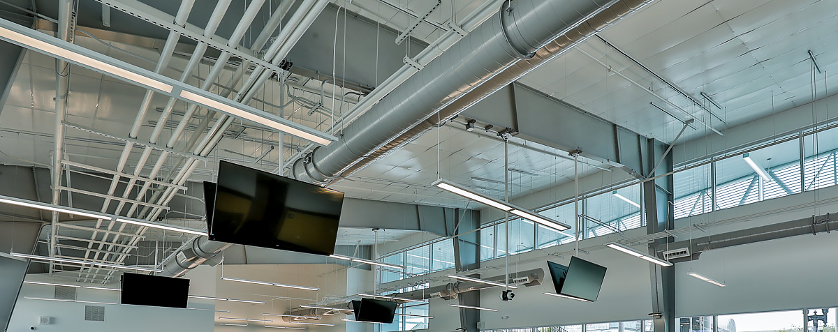 Photo of the interior of a new airport terminal, highlighting the metal building insulation